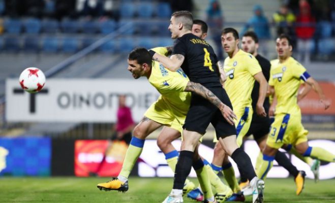 &Tau;ό&pi;&omicron;&sigmaf;... &mu;&alpha;&rho;&tau;&upsilon;&rho;ί&omicron;&upsilon; &eta; &Tau;&rho;ί&pi;&omicron;&lambda;&eta; &gamma;&iota;&alpha; &tau;&eta;&nu; &Alpha;&Epsilon;&Kappa;