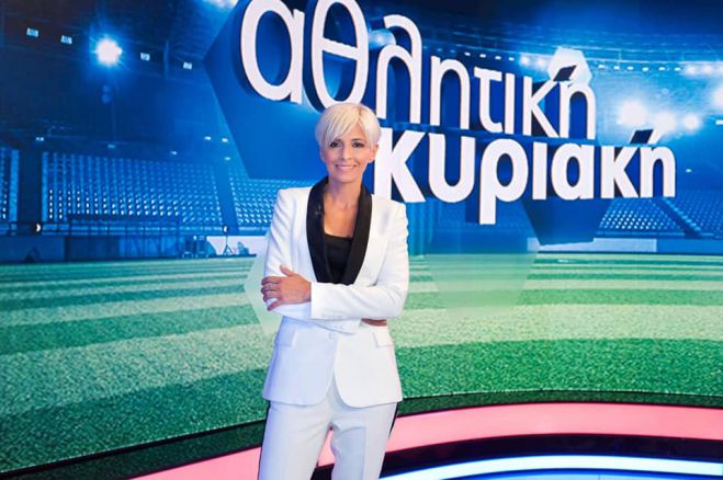 Έ&lambda;&epsilon;&nu;&alpha; &Mu;&pi;&omicron;&upsilon;&zeta;&alpha;&lambda;ά | &Eta; &pi;&alpha;&rho;&omicron;&upsilon;&sigma;&iota;ά&sigma;&tau;&rho;&iota;&alpha; &tau;&eta;&sigmaf; &laquo;&Alpha;&theta;&lambda;&eta;&tau;&iota;&kappa;ή&sigmaf; &Kappa;&upsilon;&rho;&iota;&alpha;&kappa;ή&sigmaf;&raquo; &alpha;&pi;ό &tau;&eta;&nu; &Tau;&rho;ί&pi;&omicron;&lambda;&eta; &beta;&gamma;ή&kappa;&epsilon; &nu;&iota;&kappa;ή&tau;&rho;&iota;&alpha; &sigma;&tau;&eta; &mu;ά&chi;&eta; &mu;&epsilon; &tau;&omicron;&nu; &kappa;&alpha;&rho;&kappa;ί&nu;&omicron; &tau;&omicron;&upsilon; &mu;&alpha;&sigma;&tau;&omicron;ύ (vd)