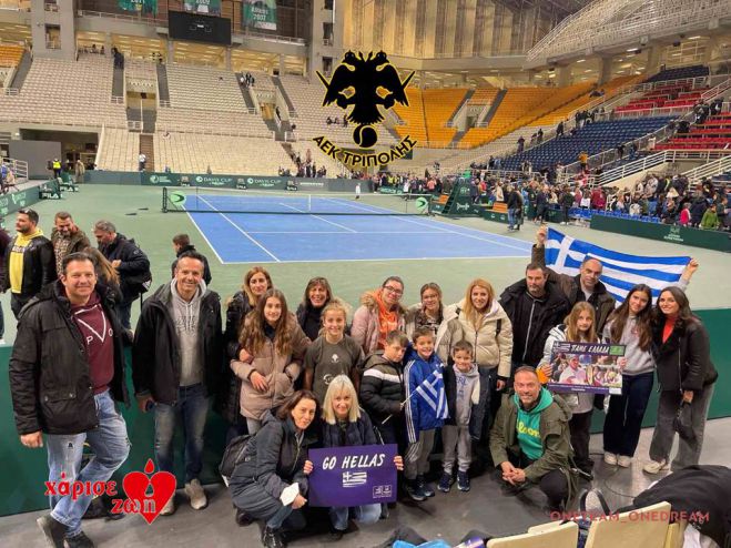 &Omicron; Ό&mu;&iota;&lambda;ό&sigmaf; &tau;&eta;&sigmaf; &Alpha;&Epsilon;&Kappa; &Tau;&rho;ί&pi;&omicron;&lambda;&eta;&sigmaf; &delta;ί&pi;&lambda;&alpha; &sigma;&tau;&eta;&nu; &pi;&rho;&omicron;&sigma;&pi;ά&theta;&epsilon;&iota;&alpha; &tau;&eta;&sigmaf; &Epsilon;&theta;&nu;&iota;&kappa;ή&sigmaf; &Omicron;&mu;ά&delta;&alpha;&sigmaf; &tau;έ&nu;&iota;&sigmaf;