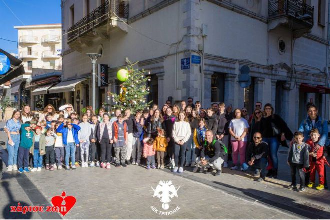 &Omicron; Ό&mu;&iota;&lambda;&omicron;&sigmaf; &tau;έ&nu;&iota;&sigmaf; &tau;&eta;&sigmaf; &Alpha;&Epsilon;&Kappa; &Tau;&rho;ί&pi;&omicron;&lambda;&eta;&sigmaf; &sigma;&upsilon;&mu;&mu;&epsilon;&tau;έ&chi;&epsilon;&iota; &sigma;&tau;&iota;&sigmaf; &Chi;&rho;&iota;&sigma;&tau;&omicron;&upsilon;&gamma;&epsilon;&nu;&nu;&iota;ά&tau;&iota;&kappa;&epsilon;&sigmaf; &epsilon;&kappa;&delta;&eta;&lambda;ώ&sigma;&epsilon;&iota;&sigmaf; &tau;&omicron;&upsilon; &Delta;ή&mu;&omicron;&upsilon; &Tau;&rho;ί&pi;&omicron;&lambda;&eta;&sigmaf;